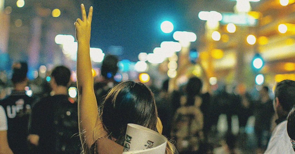 A group of peaceful protesters at night